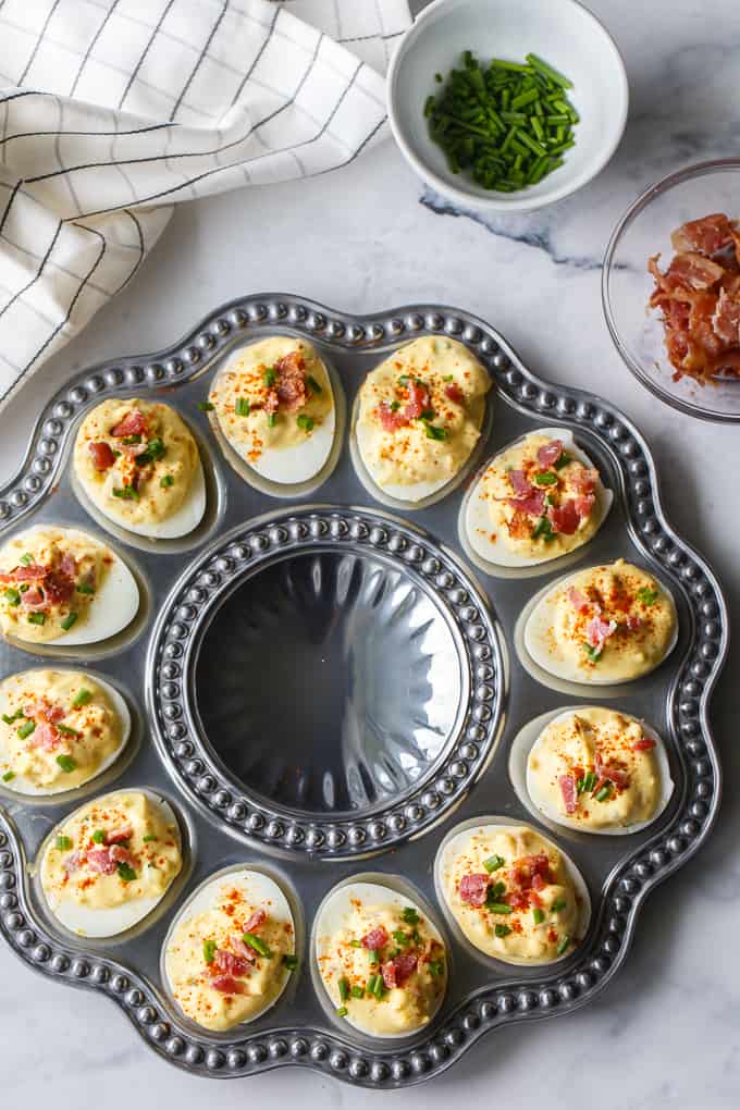 Bacon ranch deviled eggs on a silver platter