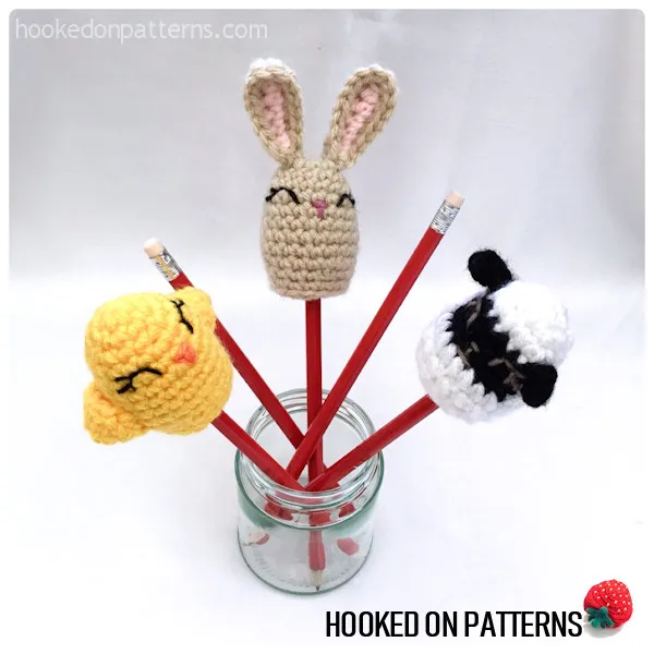 Crocheted egg covers on top of pencils