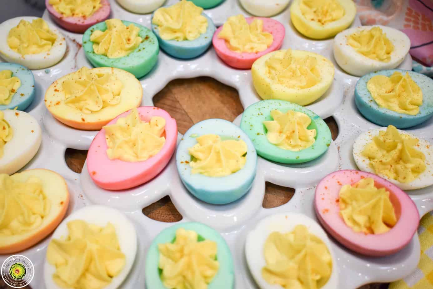 Deviled eggs Instant Pot recipe. The eggs are dyed bright colors of pink, blue, and green