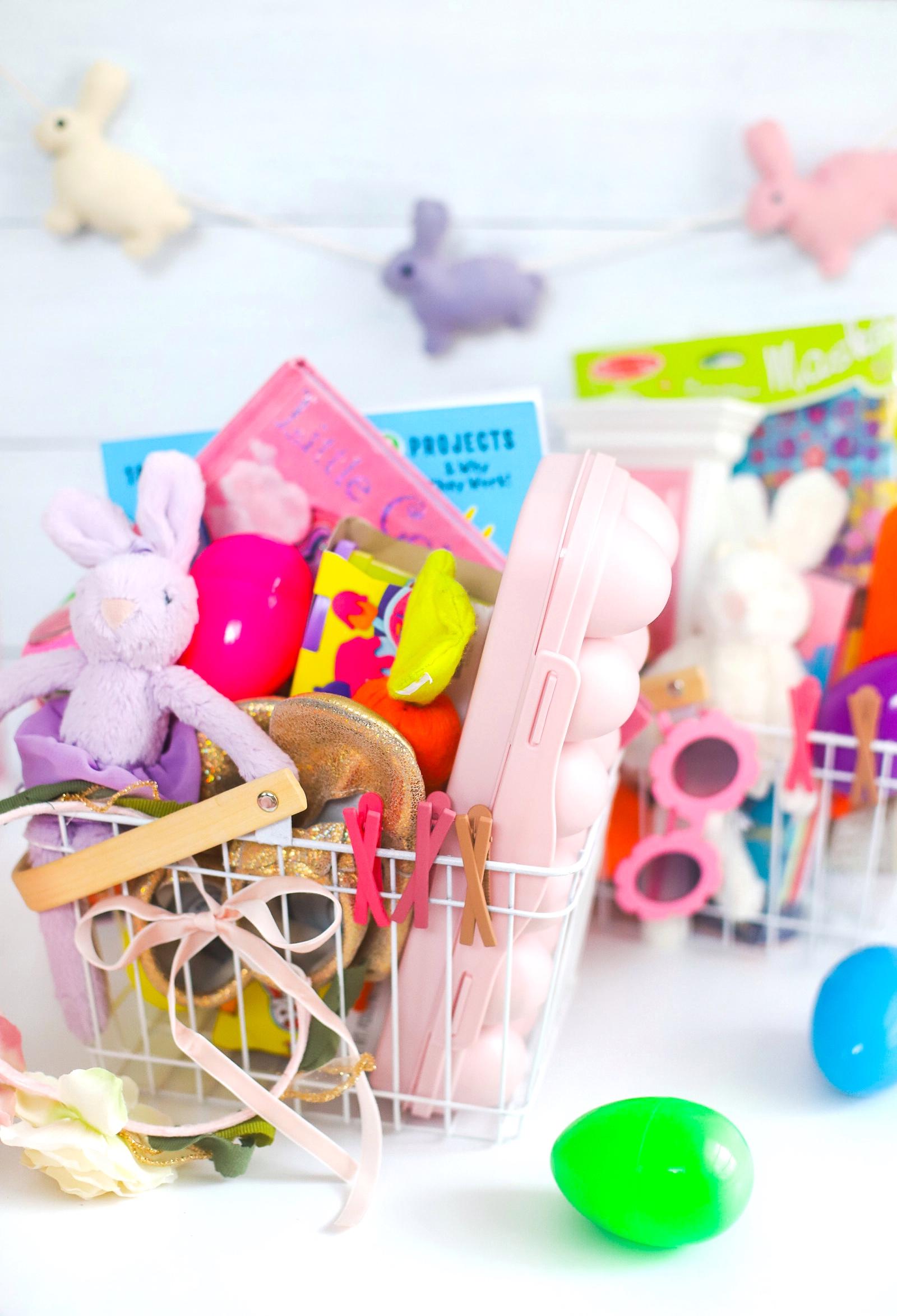 Kids Easter basket with toys, shoes, plastic eggs, and stuffed animal bunnies
