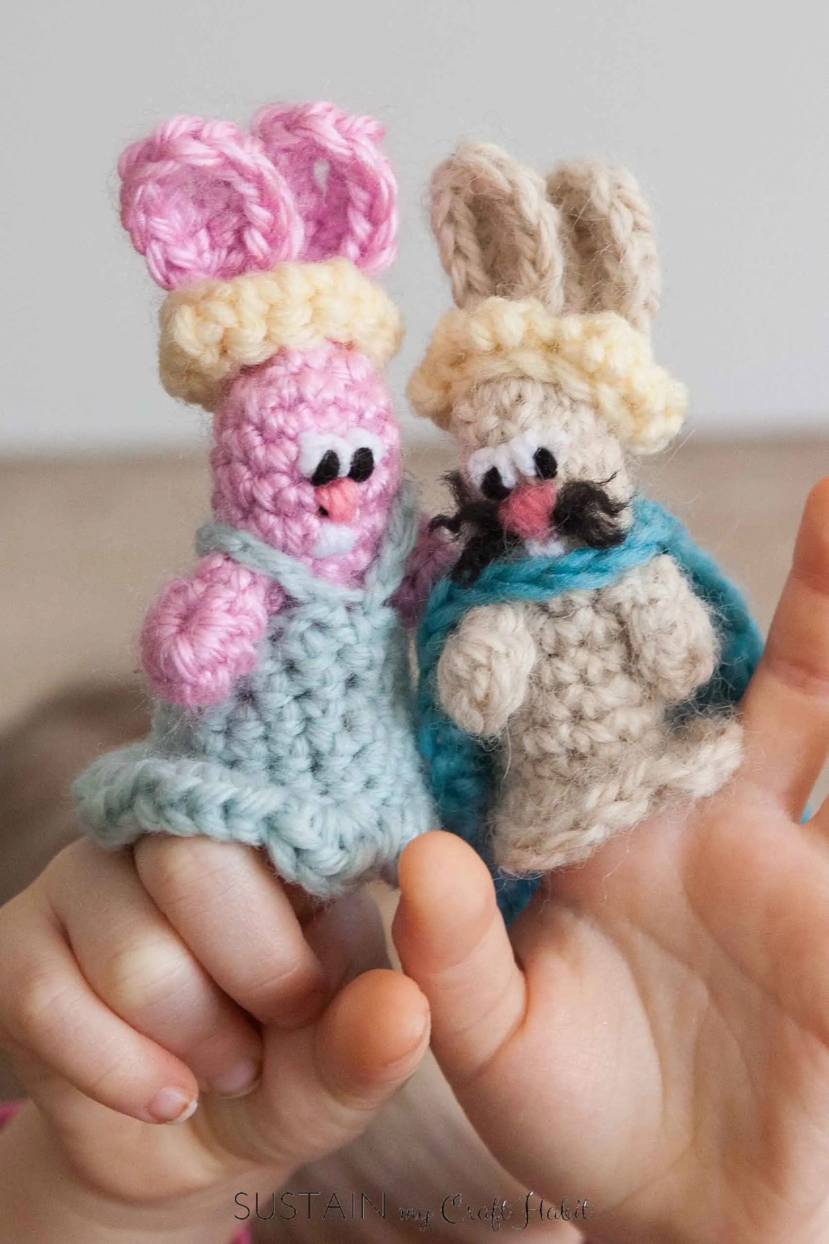 Crochet bunny finger puppets on kids fingers
