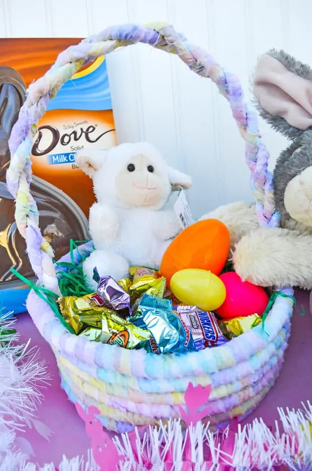 No-sew fabric Easter basket filled with candy and plastic eggs