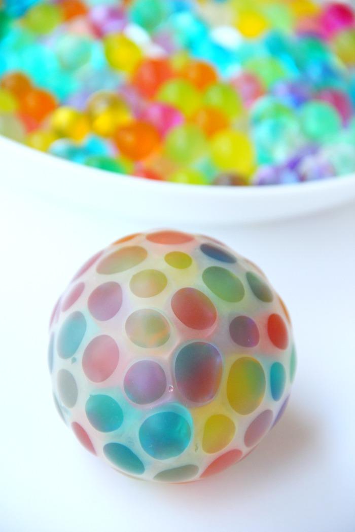 Water bead stress ball filled with colorful water beads. The ball is clear, showing off the colorful water beads