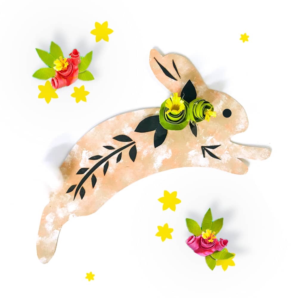 Folk art bunny, so an Easter bunny with pretty handmade flowers