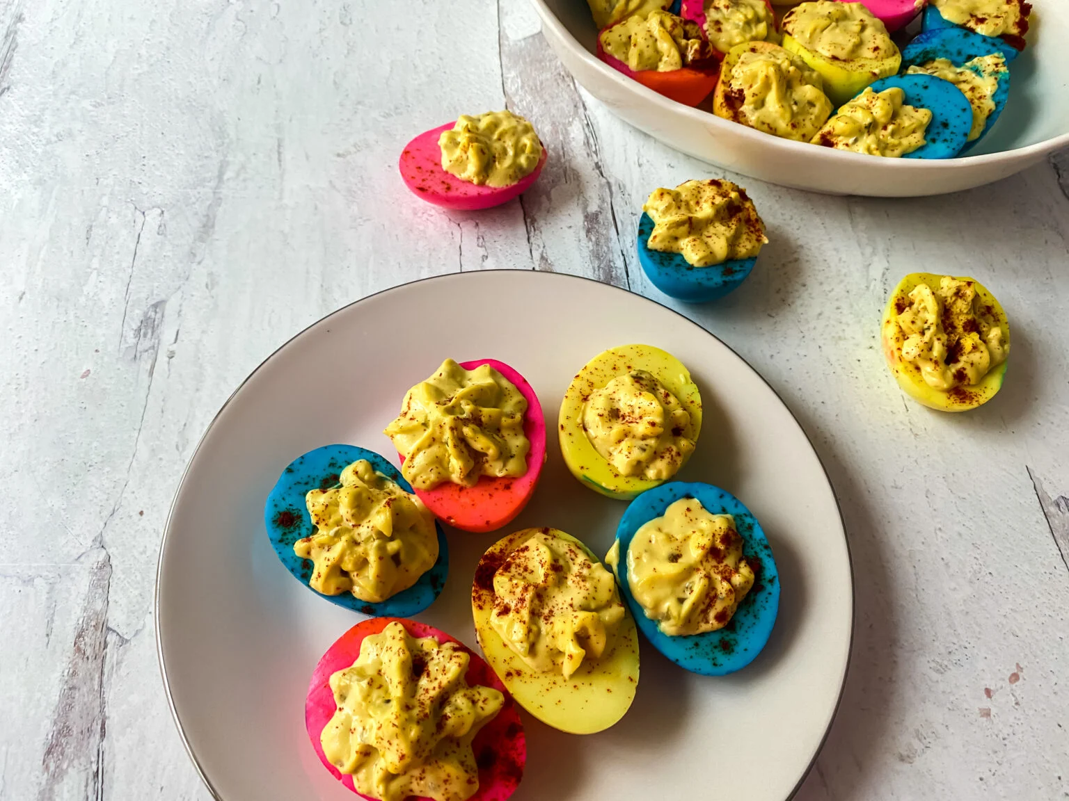 Pink, blue, and yellow colorful deviled eggs