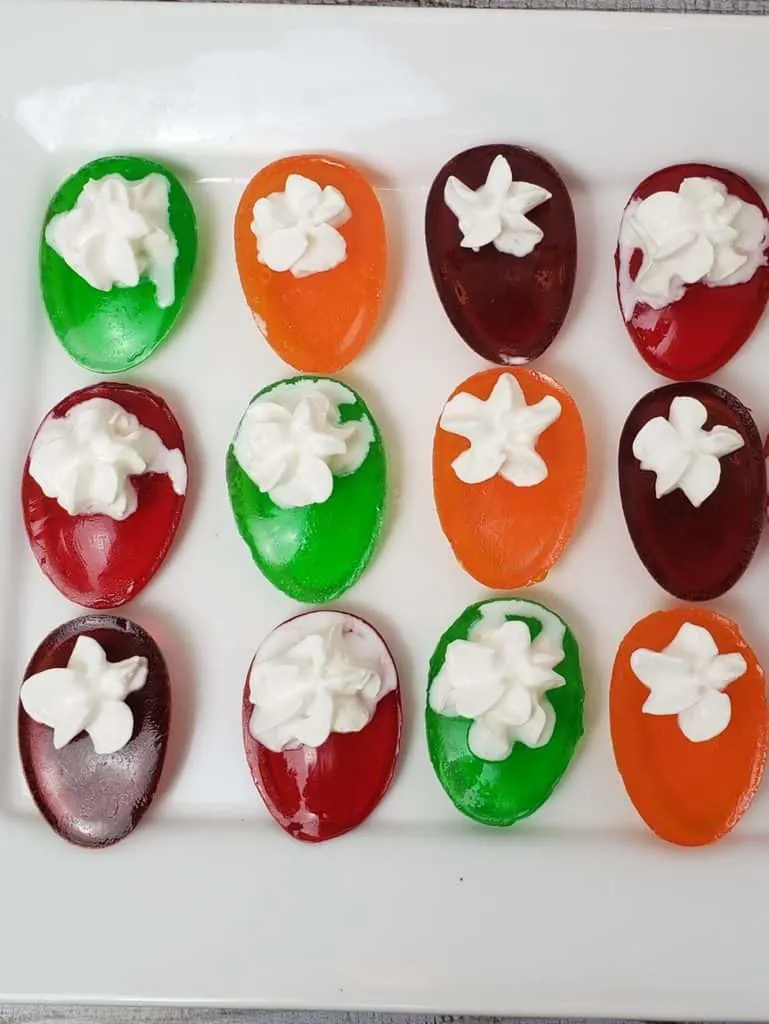 Colorful sugar-free Jell-O deviled eggs with a whipped cream filling