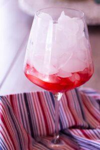 grenadine and ice in a glass