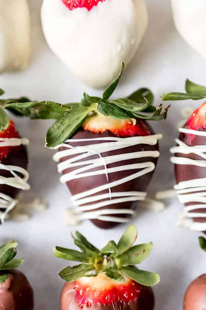 Chocolate covered strawberries with a white chocolate drizzle