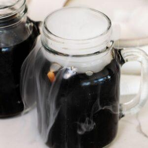 homemade rootbeer in a glass with dry ice