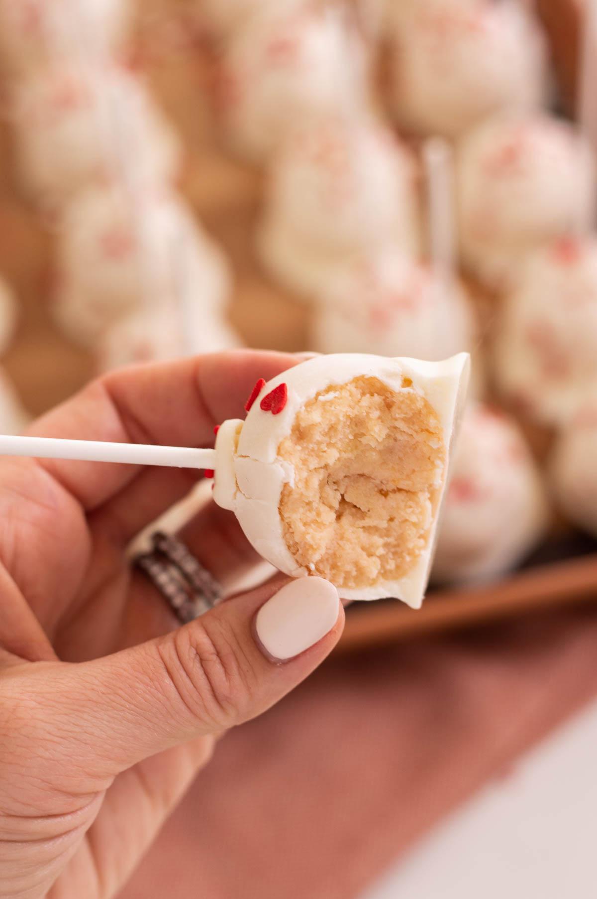 Valentines cake pops on a stick in a hand