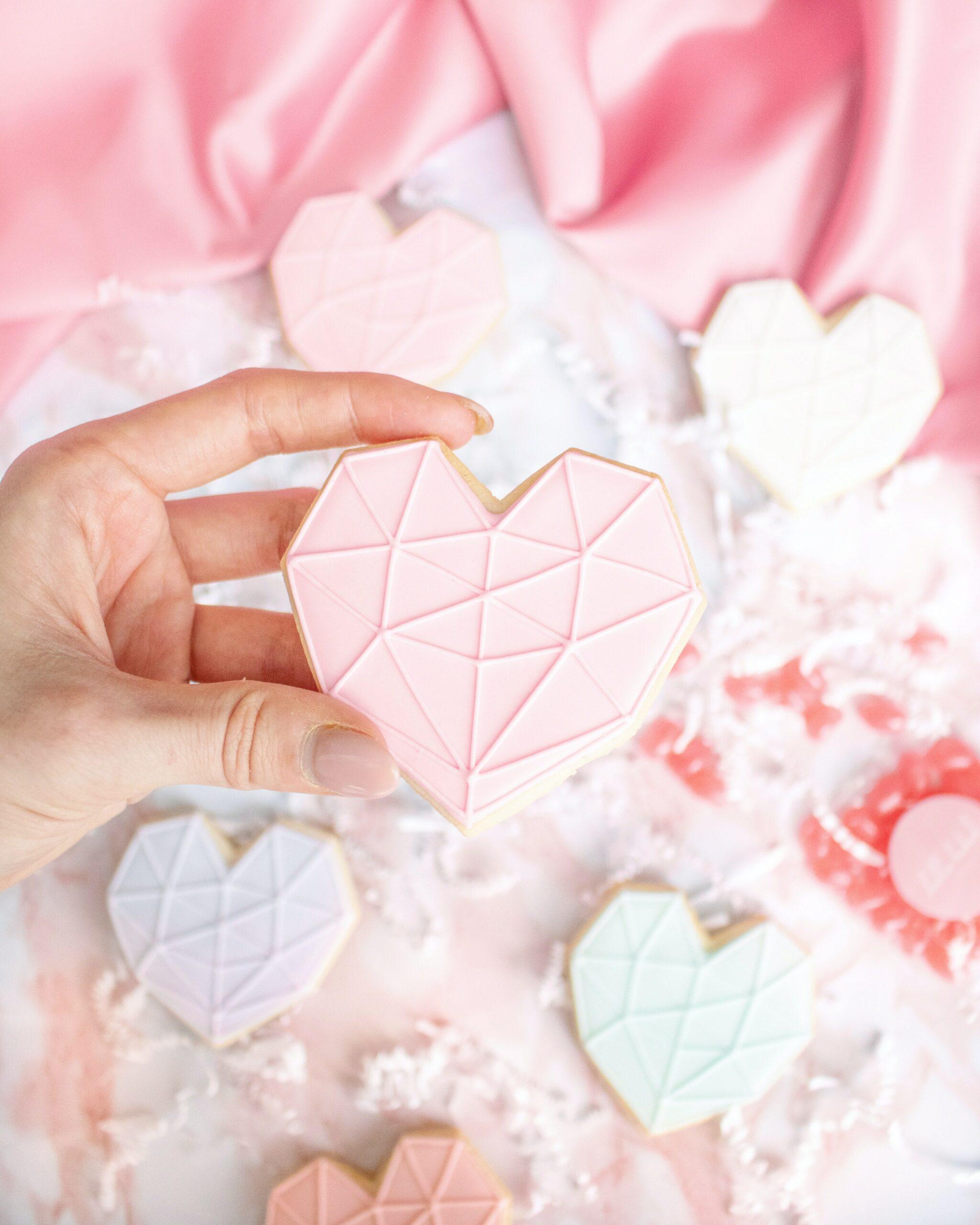 geometric heart shaped sugar cookies with pink frosting