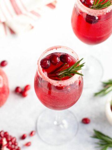 Non Alcoholic Champagne in a glass with cranberries