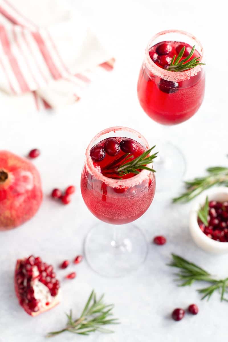 Non-alcoholic champagne drink with pomegranate and cranberries in a glass