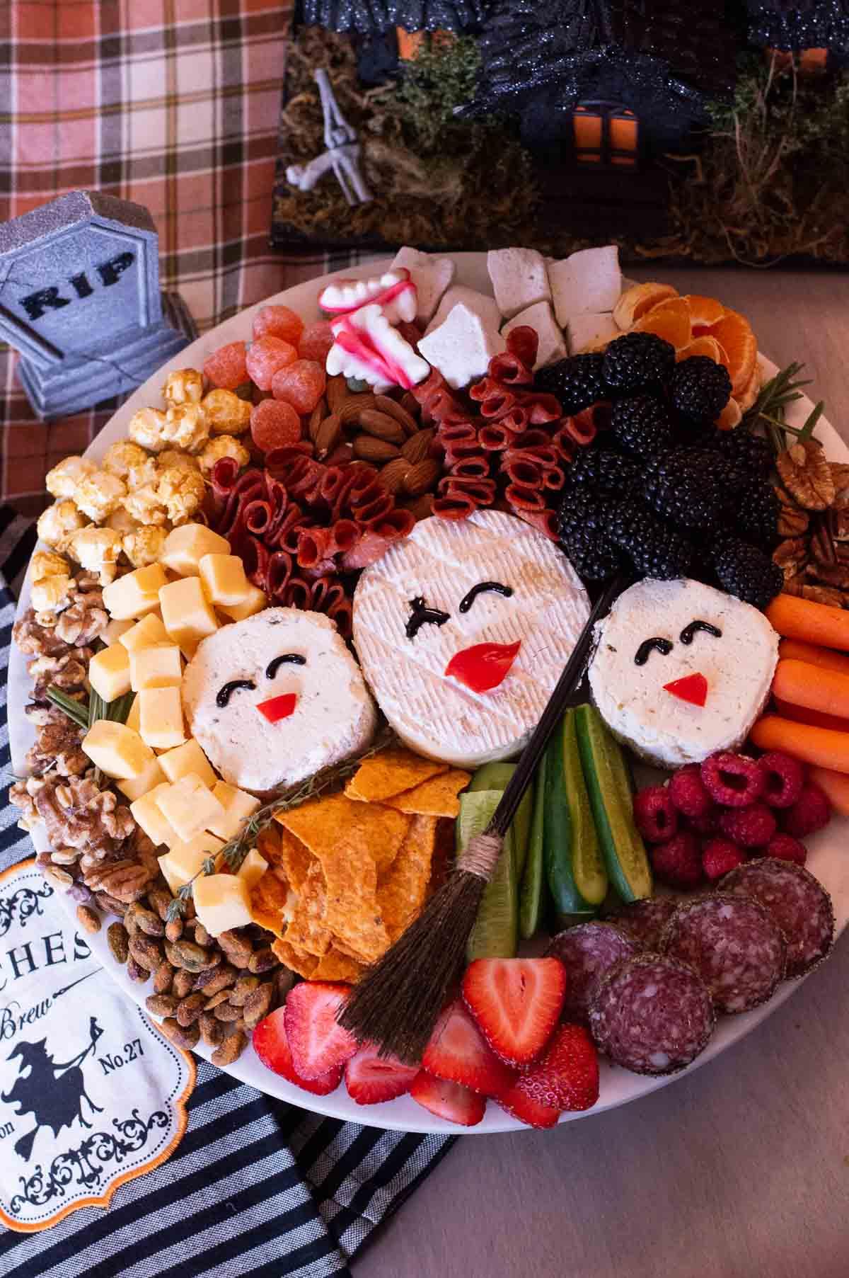 Hocus Pocus Charcuterie Board witches faces with cheese
