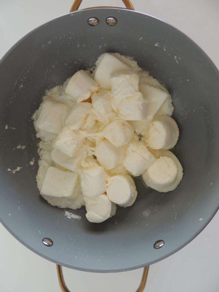 marshmallows melted in a pot with spatula