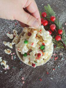 Easy Christmas Popcorn in a basket and bowl with red and green M&M's