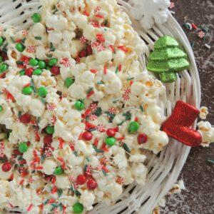 Easy Christmas Popcorn in a bowl with red and green M&M's