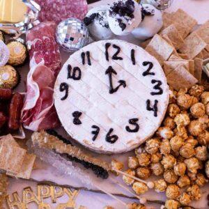 New Year's Eve Charcuterie Board with brie clock