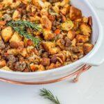 Old Fashioned Thanksgiving Dressing Recipe in white dish with sausage