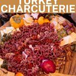 Thanksgiving Turkey Charcuterie Board with salami feathers and pear body pin