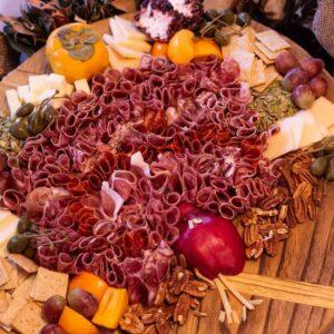Thanksgiving Turkey Charcuterie Board with salami feathers and pear body