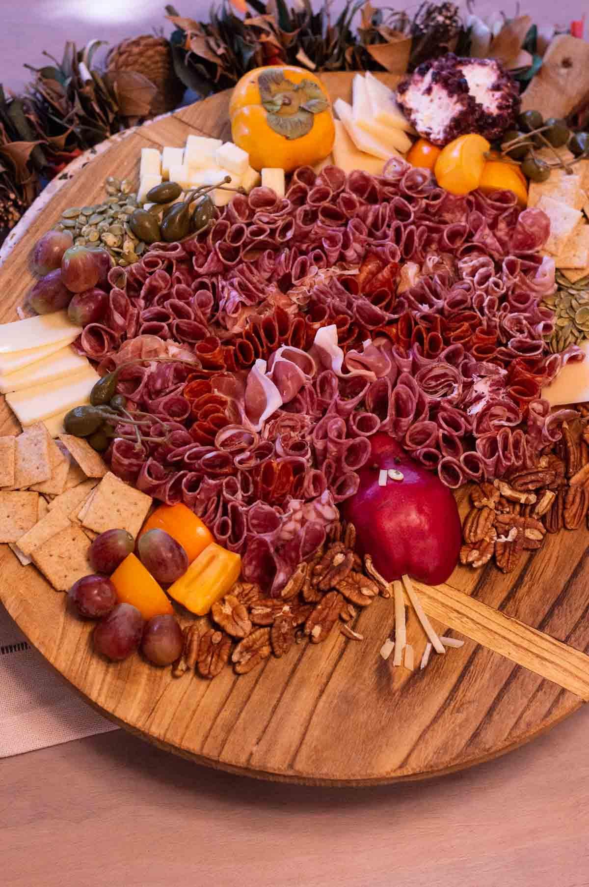 Thanksgiving Turkey Charcuterie Board with salami feathers and pear body