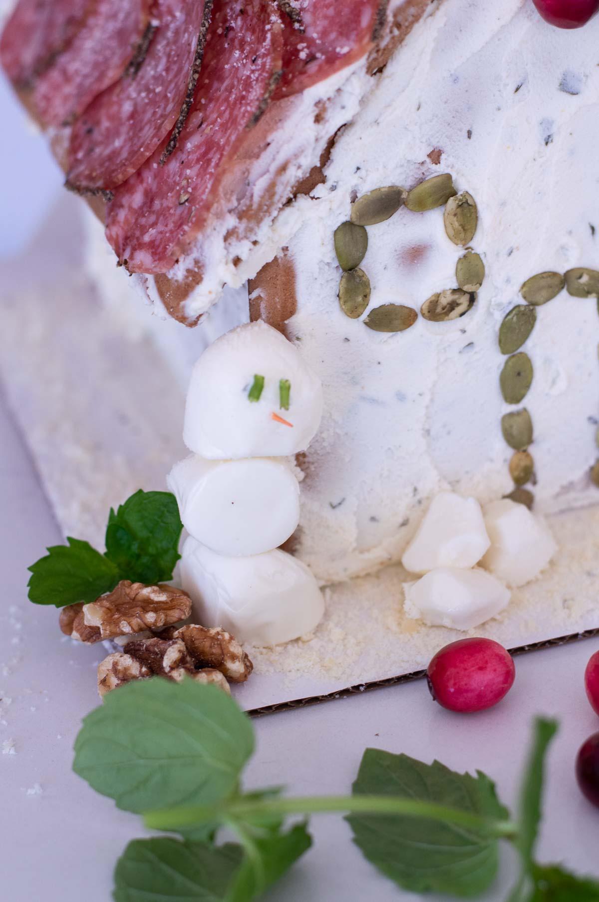 Charcuterie Chalet with cheese snowman