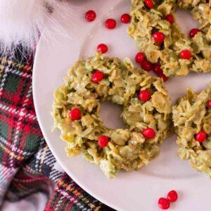 Christmas wreath cookies on a white plate