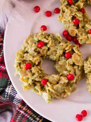 Christmas wreath cookies on a white plate