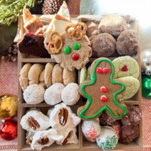 Holiday Cookie Boxes wtih gingerbread men, reindeer cookies, candy and more.