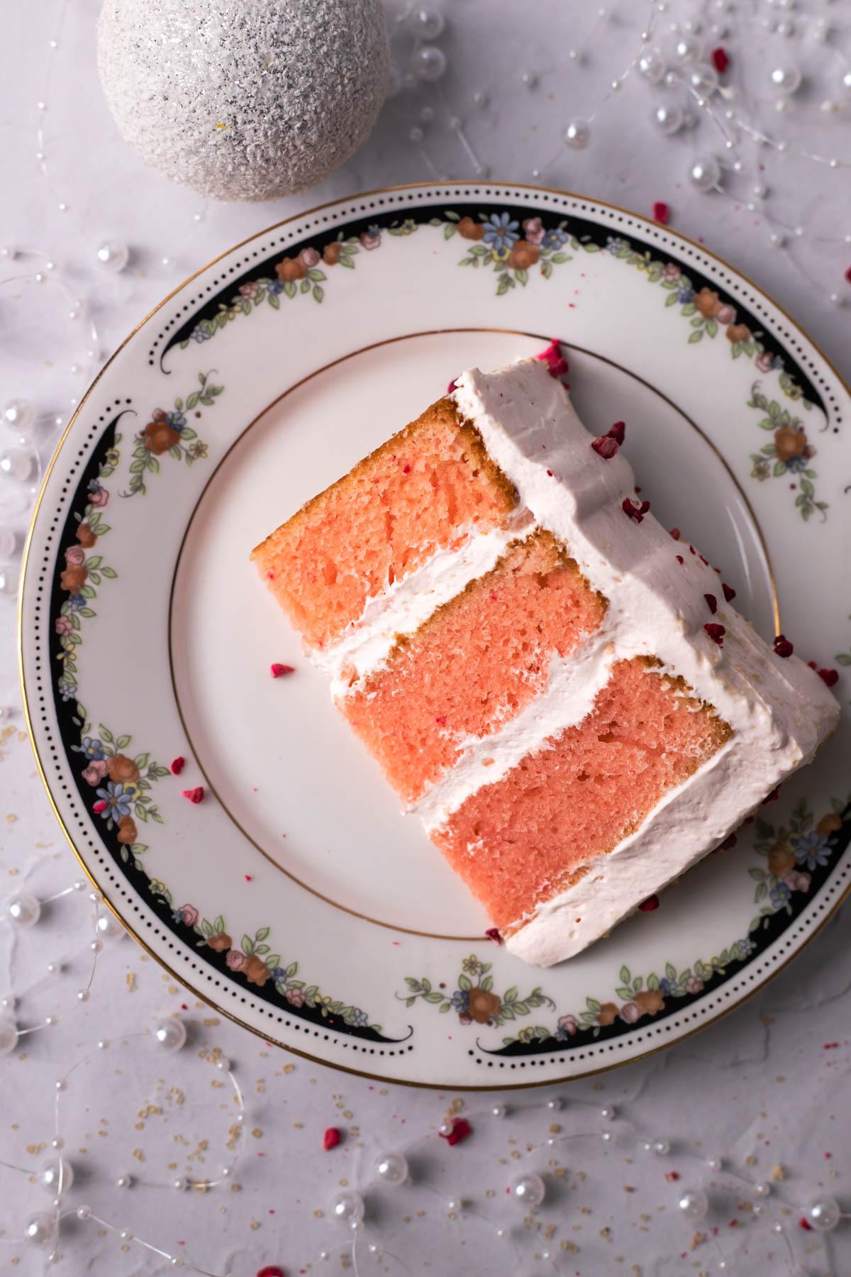 Pink Champagne Cake slice on a plate