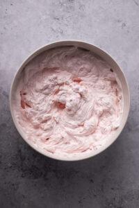 Pink Champagne Cake frosting in a bowl