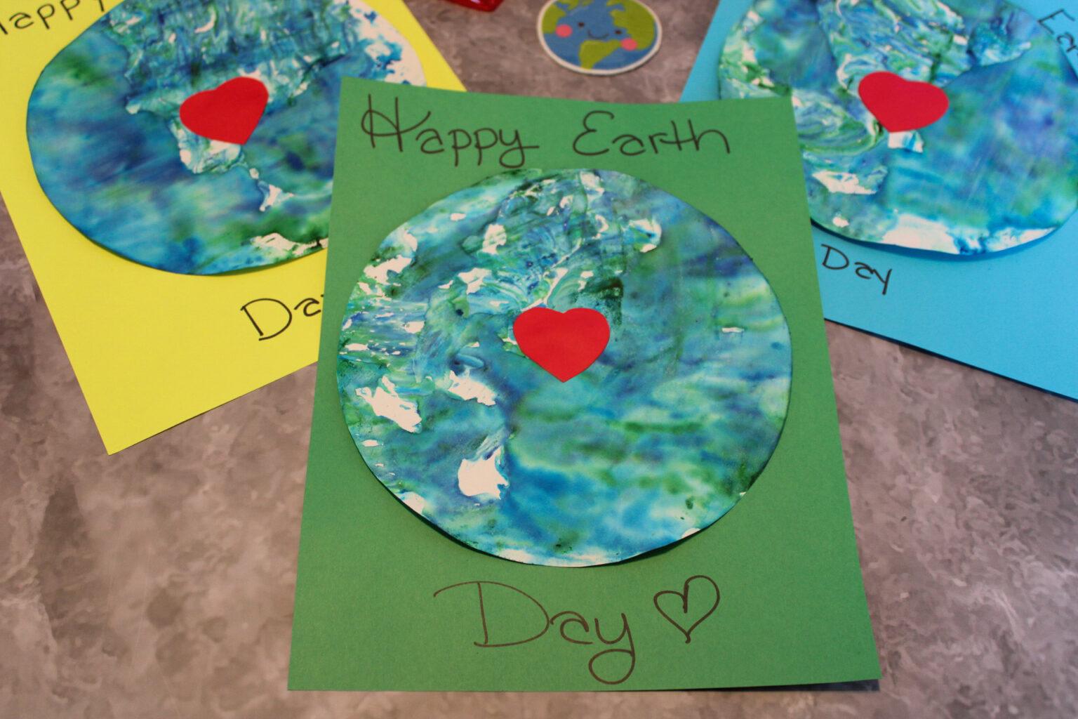 Easy earth day craft with shaving cream and blue and green paper