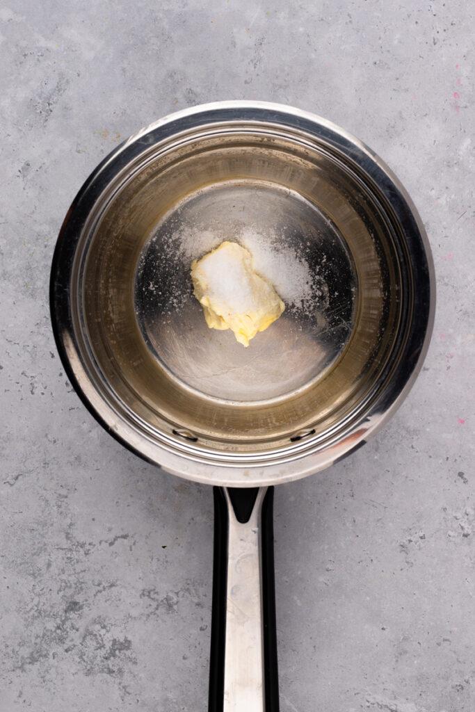 stainless steel pan with butter and salt inside