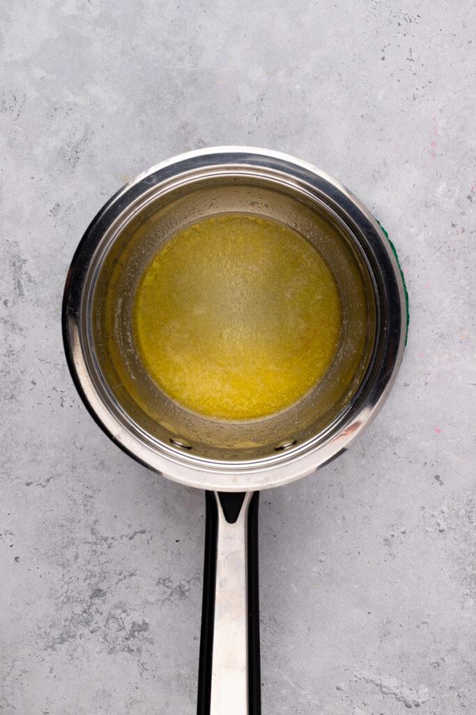 stainless steel pan of melted butter